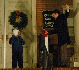 Mayor and Dakota flipping the switch to light the tree